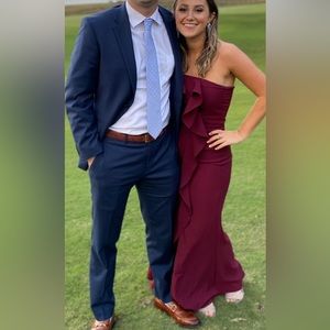 Maroon dress from Lulus. Tight maroon long dress with ruffle along front.